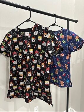 Woman Holiday Scrub Top - Black and Navy. Size XS